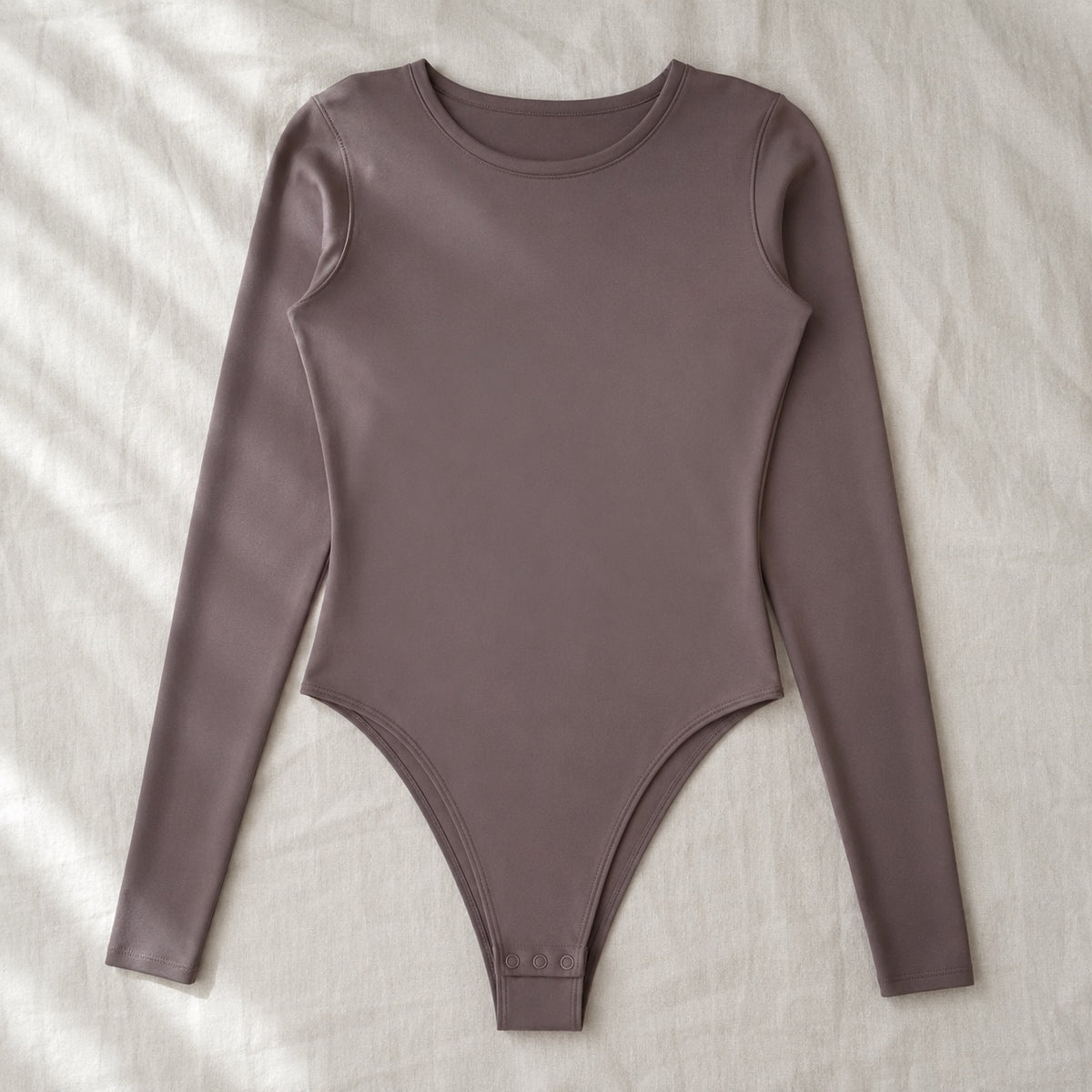 Seale long-sleeve base layer bodysuit, Long-Sleeve Base Layers — front view, photographed flat.