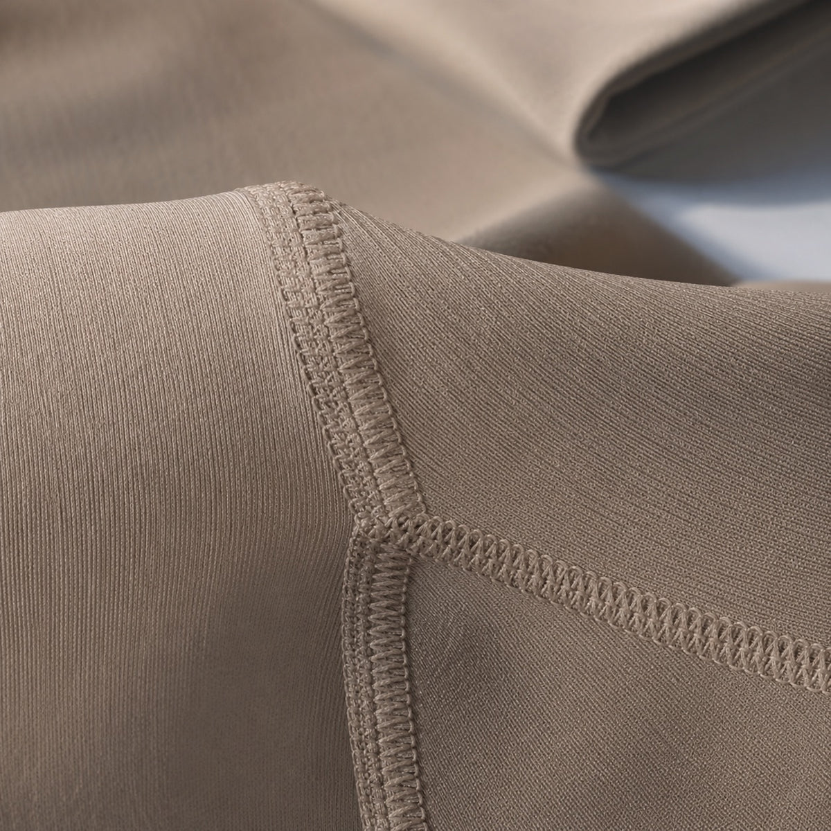 Farnham long-sleeve base layer bodysuit, Long-Sleeve Base Layers — close-up of the cloth and stitching.