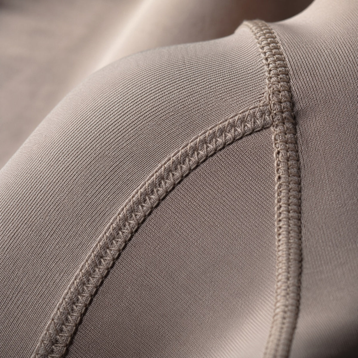 Badshot long-sleeve base layer bodysuit, Long-Sleeve Base Layers — close-up of the cloth and stitching.