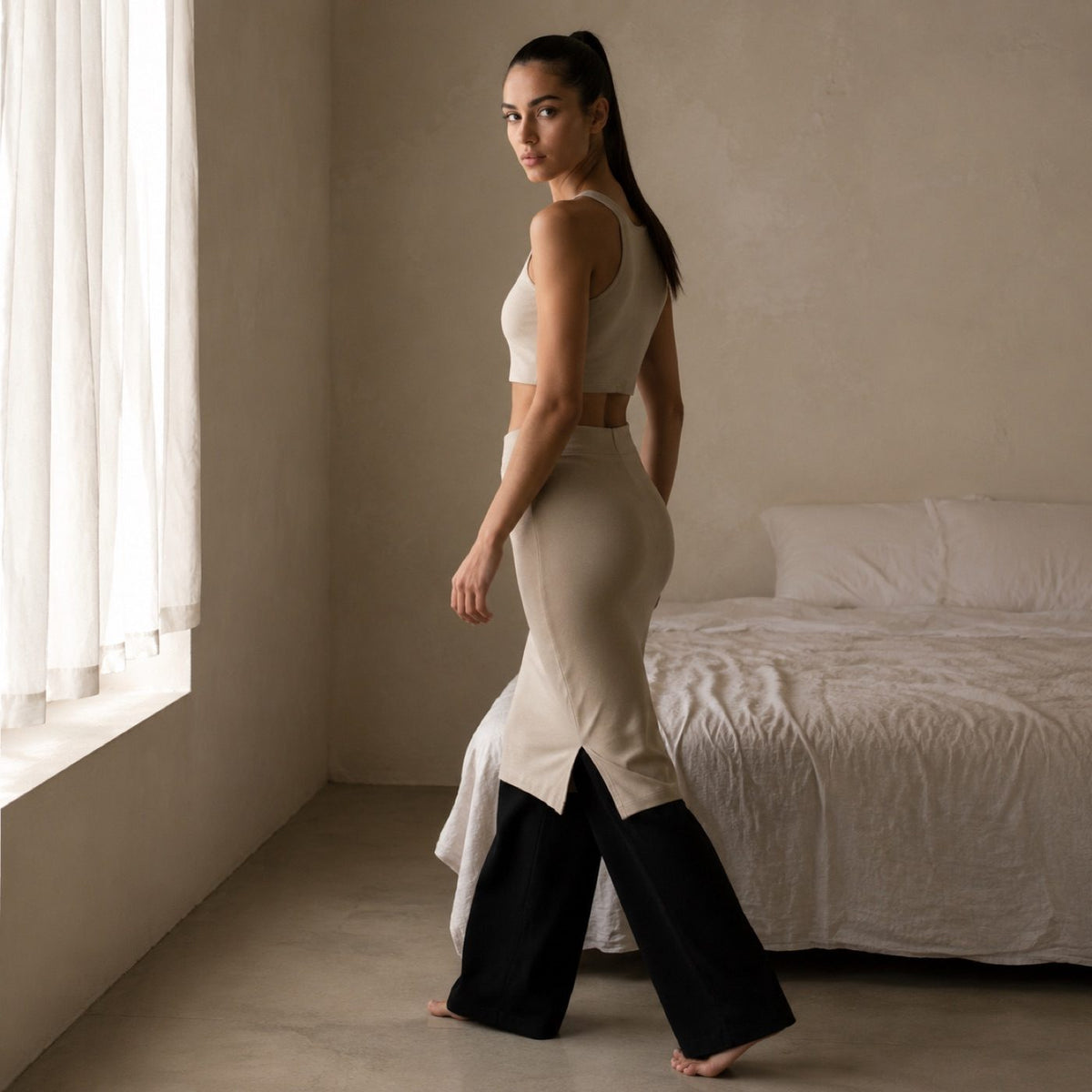 Bentley seamless knee-length skirt, Seamless Layers — modelled, side view.