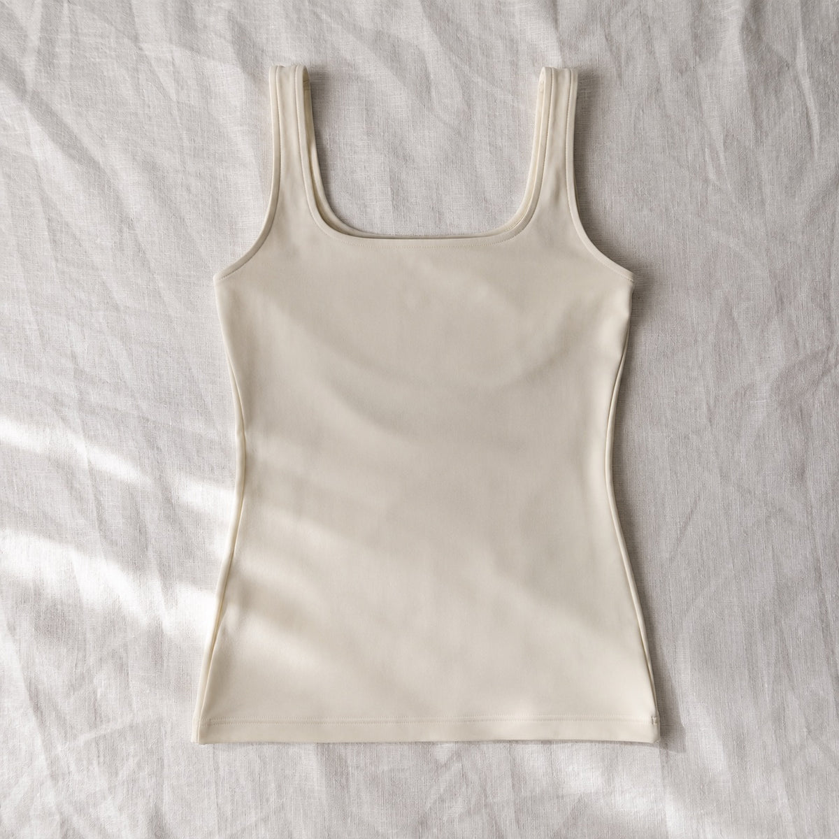 Bentley longline sculpt tank, Sculpt Tanks — front view, photographed flat.